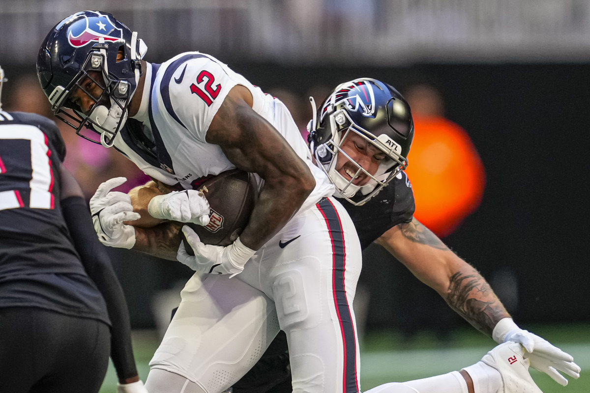 Houston Texans wide receiver Nico Collins (12) runs against Atlanta Falcons linebacker Nate Landman (53).